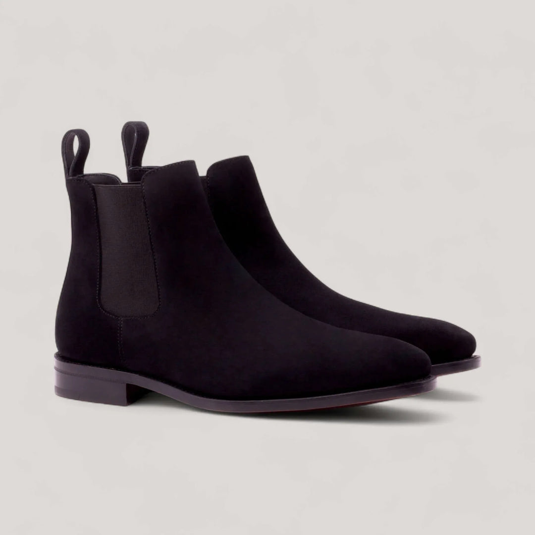 Pair of black suede Chelsea boots, front three-quarter view