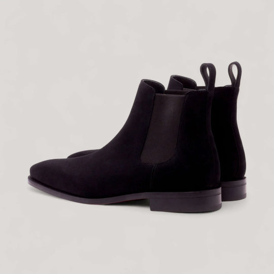 Pair of black suede Chelsea boots, rear three-quarter view
