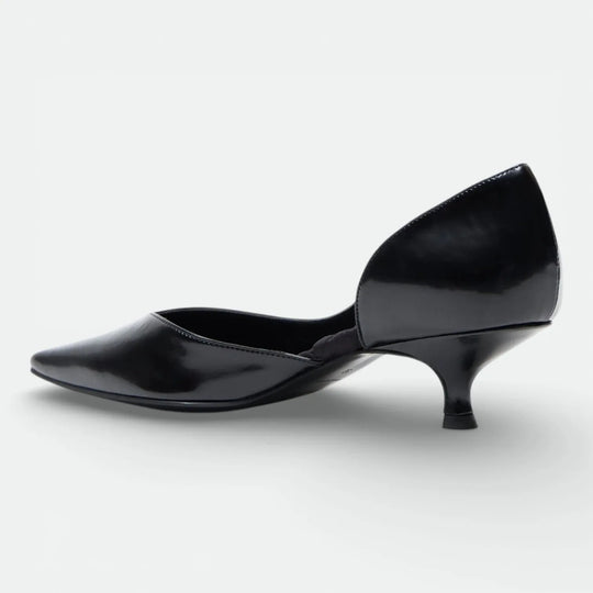 Black patent leather pointed-toe kitten heel shoe on white background