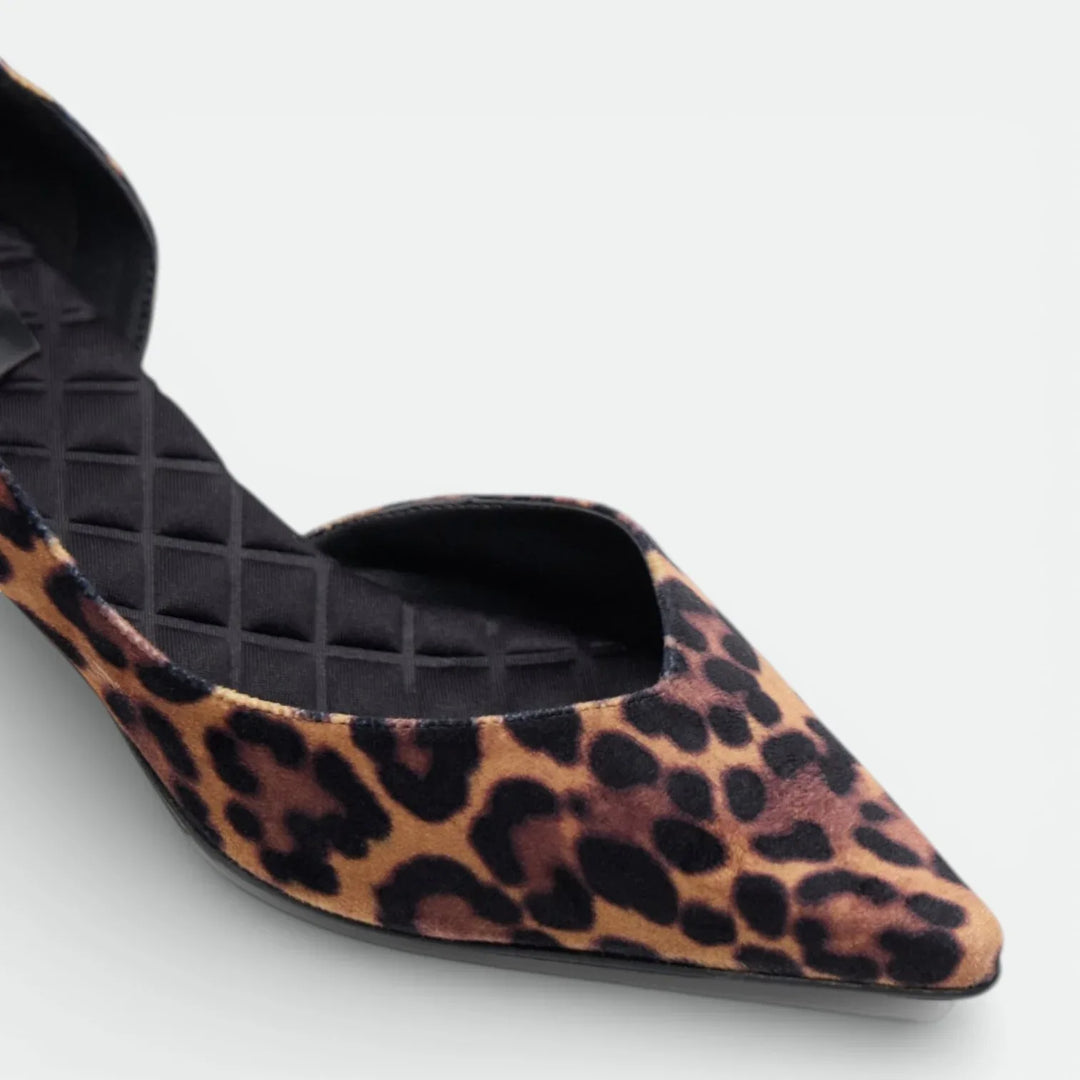 Leopard print pointed toe flat shoe with black cushioned insole on white background