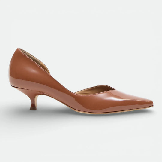 Mocha brown patent leather pointed-toe kitten heel pump on white background