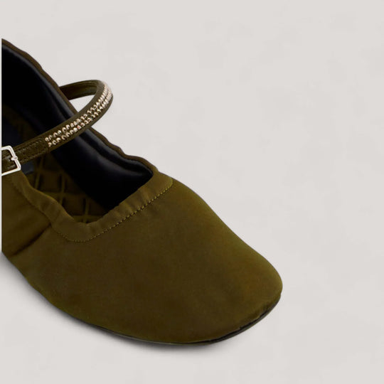 Military satin crystal Mary Jane flat with an adjustable buckle vamp strap and elastic heel support, designed for comfort and style. Vegan, sustainable designer shoe.