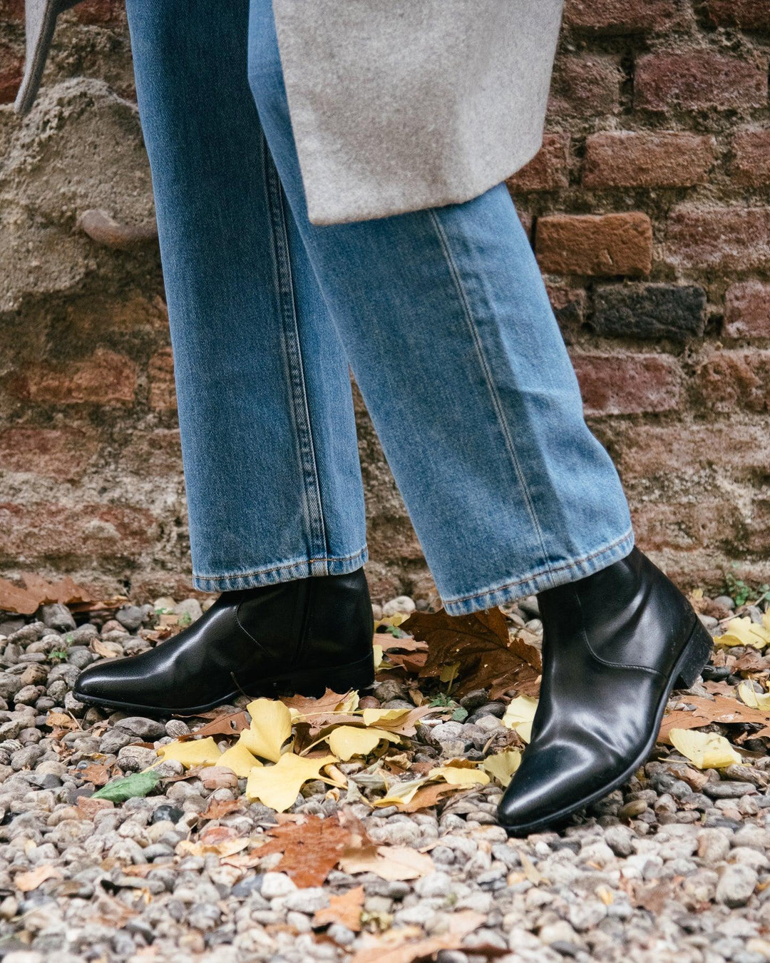 Charli black vegan nappa ankle boot by AERA, sustainable vegan shoes, styled with jeans, crafted in Italy, inspired by Stella McCartney.