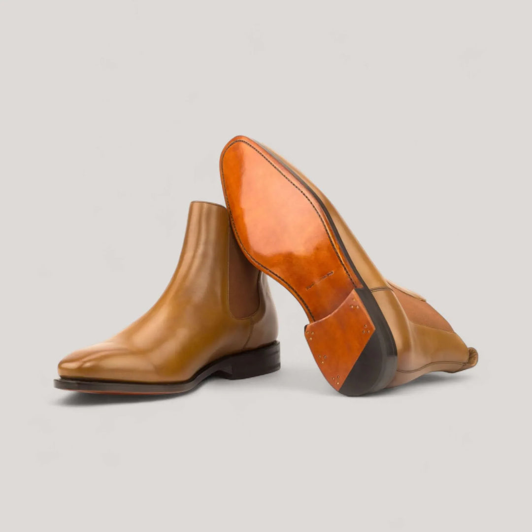 Cognac box-calf Chelsea boots showing the full leather sole