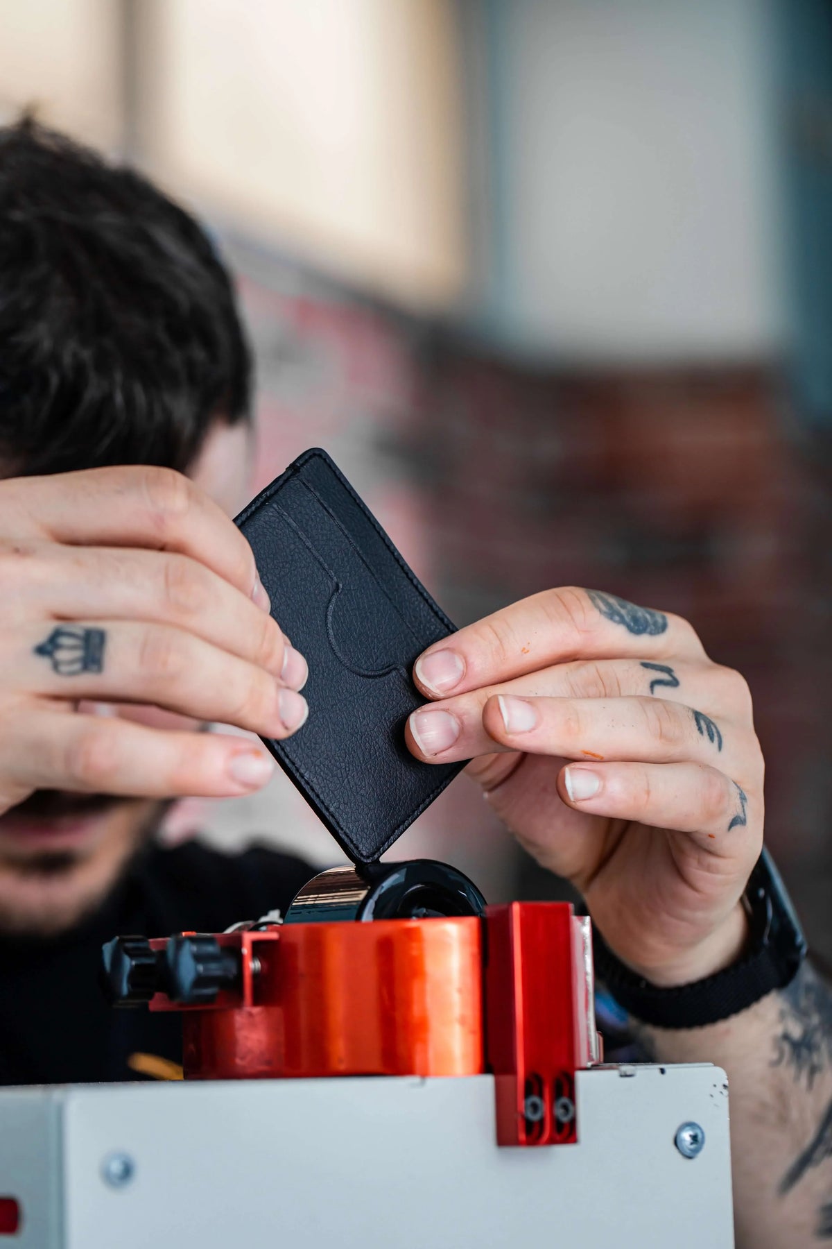 An artisan inspecting an Oliver Co. accessory in the Istanbul workshop