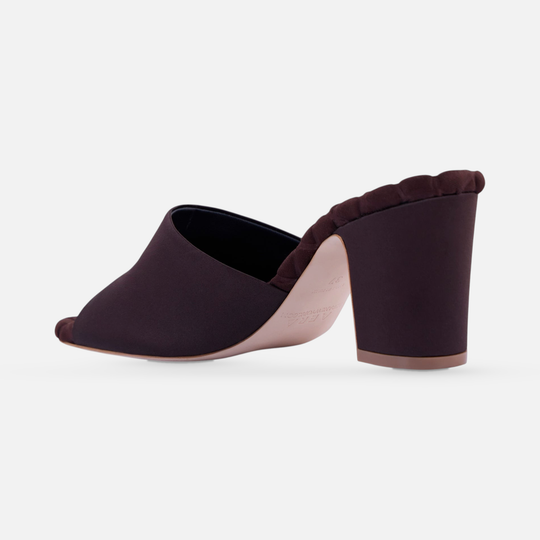 AERA GIULIA brown satin block heel mule, rear three-quarter view showing the heel and sole.
