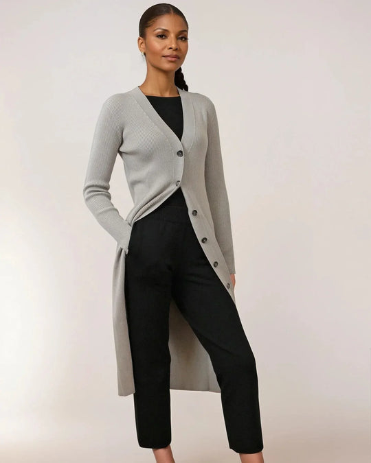 Model wearing HOLLY ecoviscose long ribbed cardigan in grey, showcasing sustainable luxury knitwear.