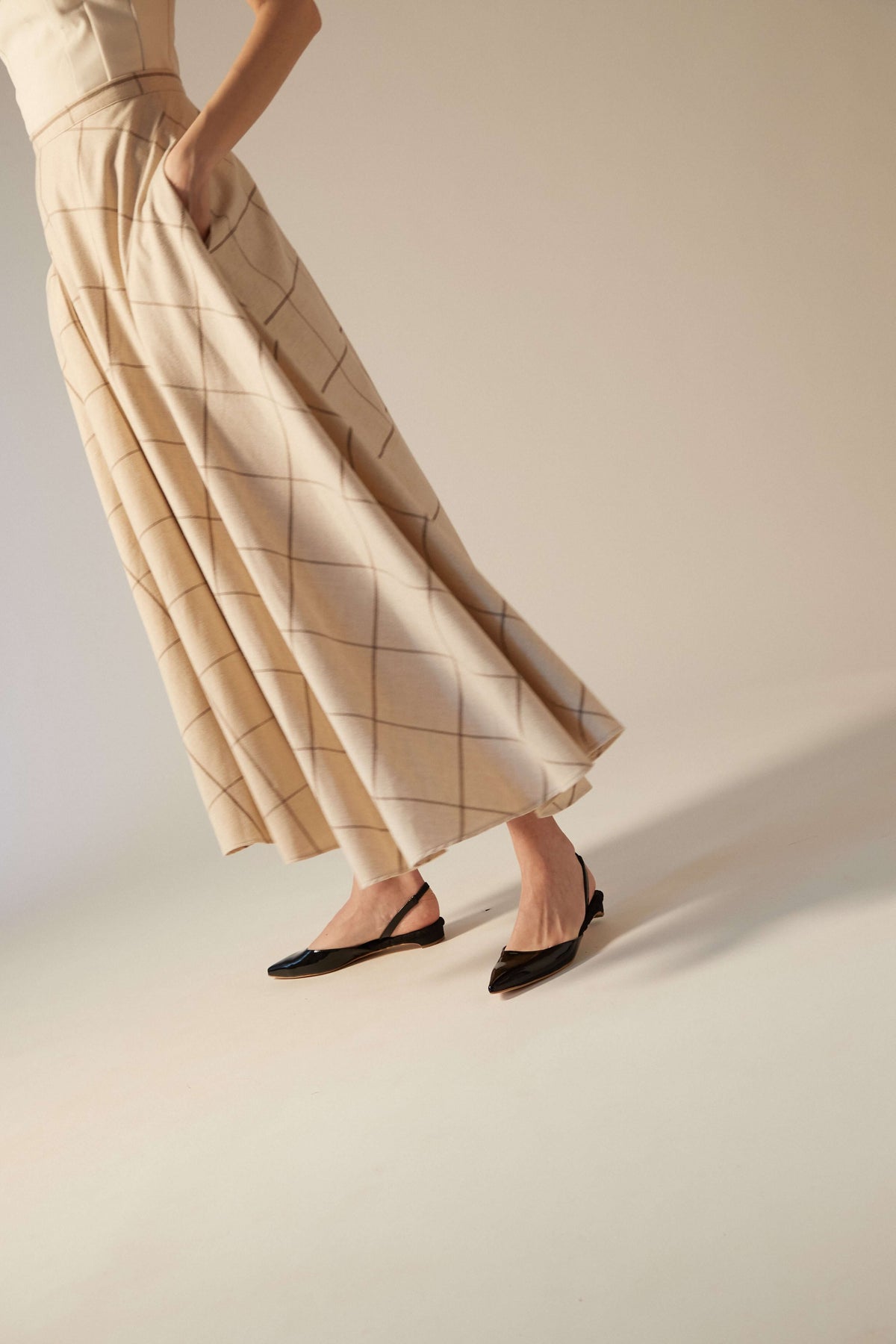 AERA black pumps styled with tailored clothing