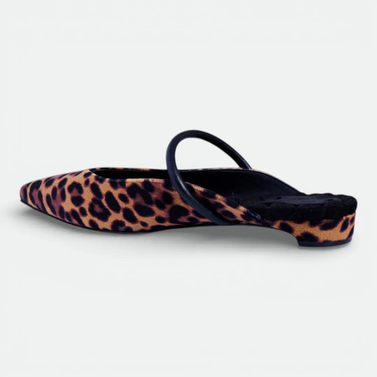 Pointed-toe mule with leopard print and black strap, low heel shoe on white background.