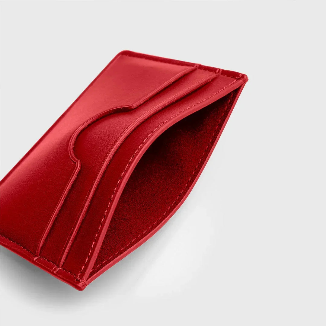 Chilli red premium leather card holder with curved slot, minimalist design on white background
