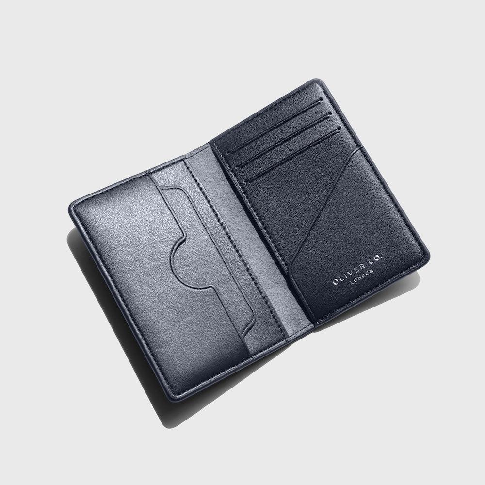 Slim coastal blue compact wallet with multiple card slots, open on a light background