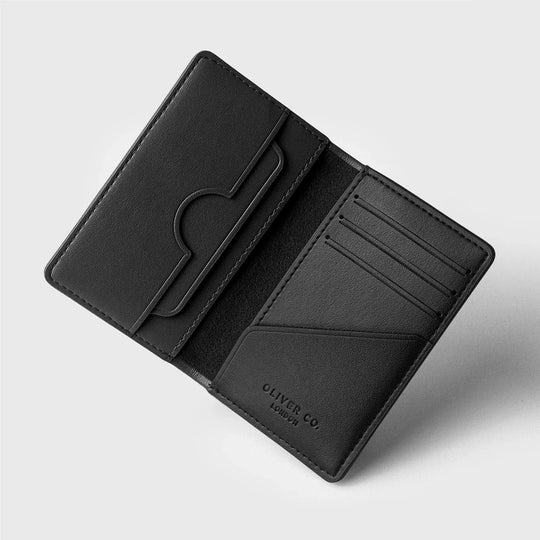 Premium black bifold wallet with card slots and metal money clip on a white background