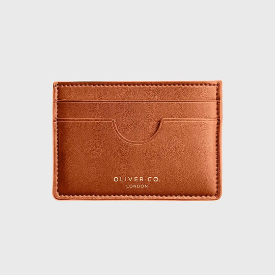 Slim burnt orange card holder wallet with multiple slots on a light background