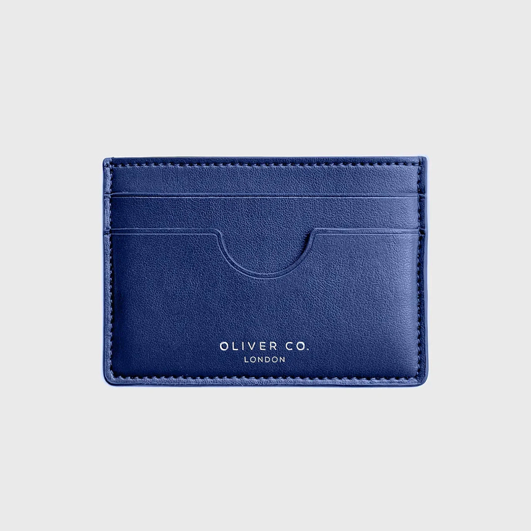 Slim cobalt blue card holder wallet with three card slots on a light background