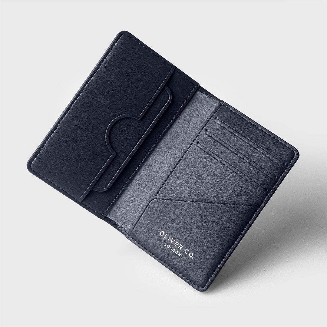 Open coastal blue wallet with card slots and compartments on light background