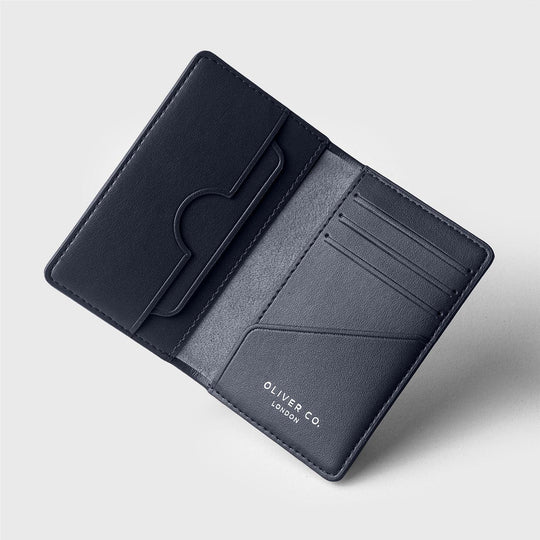 Open coastal blue wallet with card slots and compartments on light background