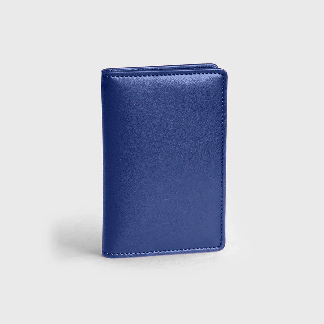 Premium cobalt blue leather wallet standing on a plain light background