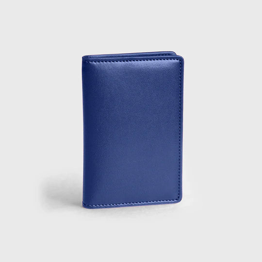 Premium cobalt blue leather wallet standing on a plain light background