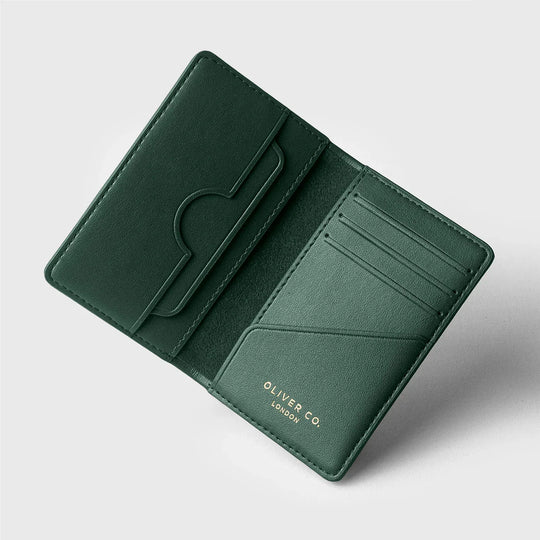 Minimalist green leather bifold wallet with card slots and sleek interior design