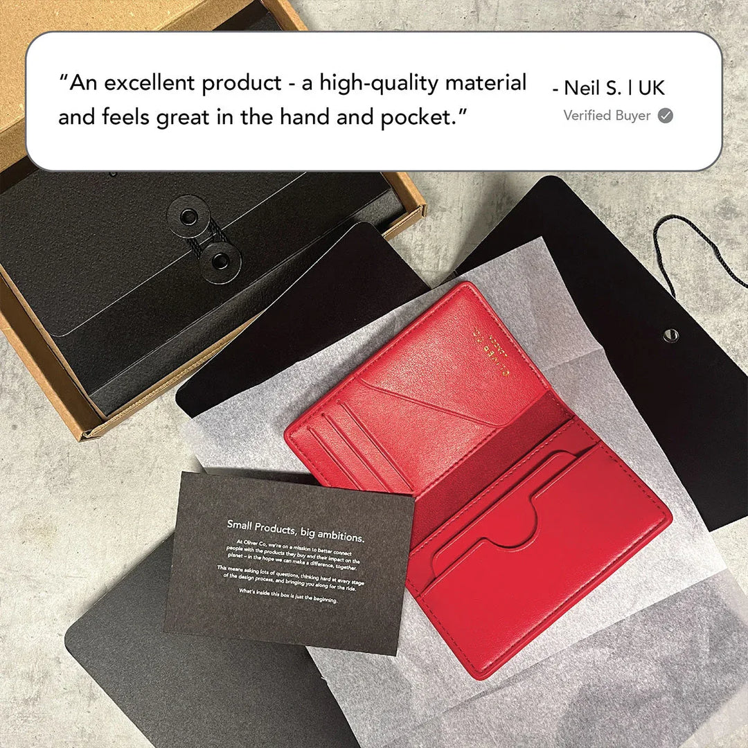 Red premium compact wallet with card slots, elegant packaging, and product information card.