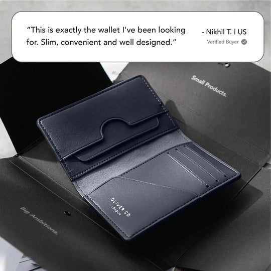 Slim black leather compact wallet open to show card slots, luxury minimalist design