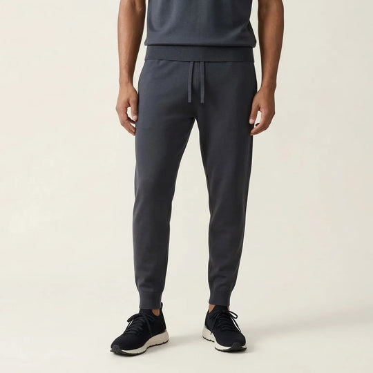 Men's black jogger sweatpants with drawstring waist and ribbed cuffs, casual style