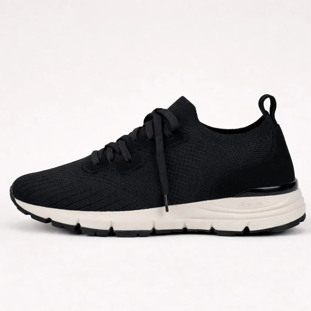 Black knit lace-up sneaker with white Vibram sole, minimalist modern design