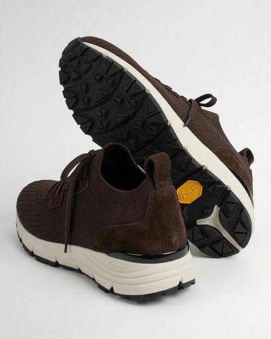 Brown suede and knit sneakers with thick white soles and black Vibram outsoles