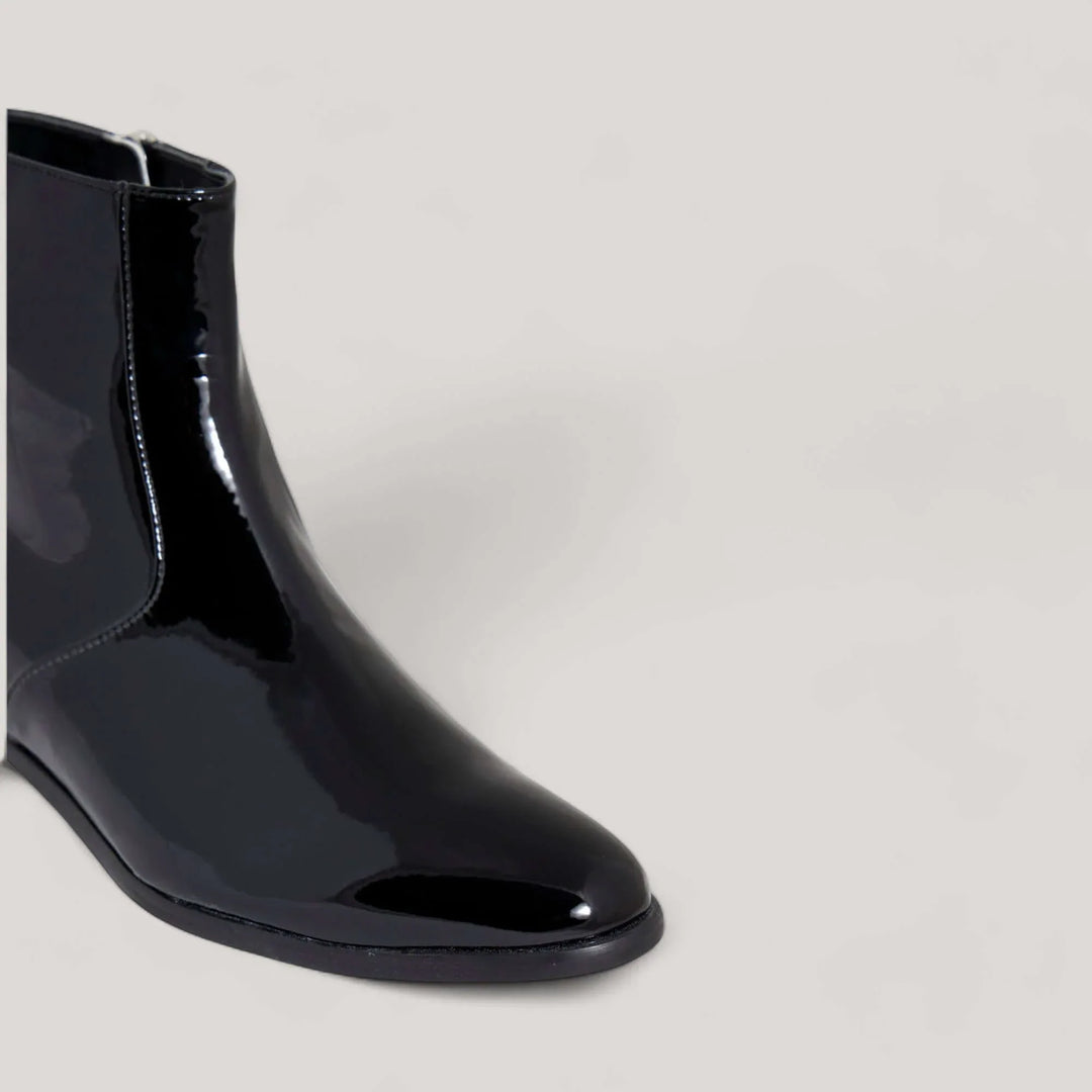 Black vegan patent ankle boot by Charli from AERA, made with sustainable materials, handcrafted in Italy.