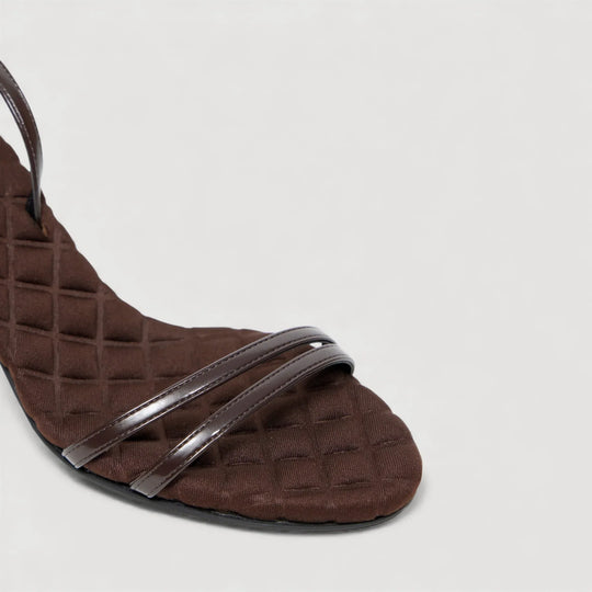 LAURA | Brown - Ankle Strap Sandal from AERA NEW YORK, luxury vegan shoes with a quilted footbed and refined ankle strap.
