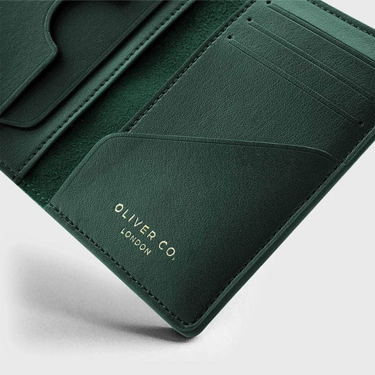 Green vegan leather compact wallet with card slots and subtle gold text