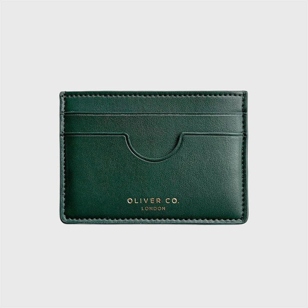 Dark green slim vegan card holder wallet with multiple slots, gold embossed text, on white background