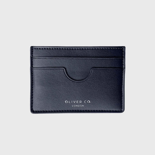 Black vegan slim card holder with card slots on a light background