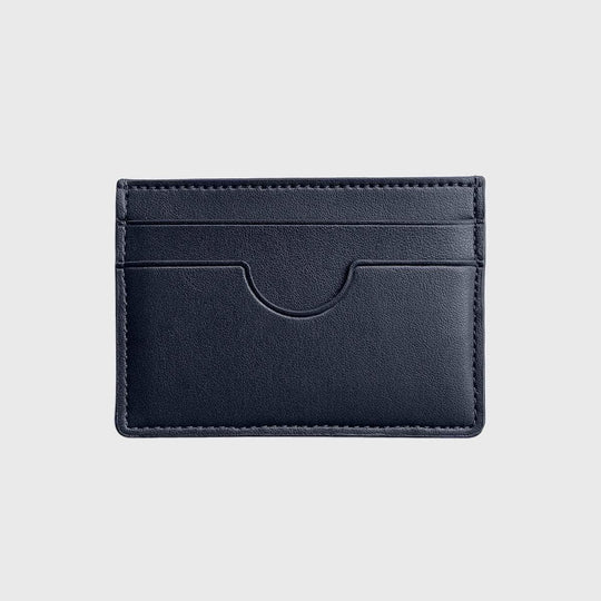 Slim black vegan card holder with multiple slots on a neutral background