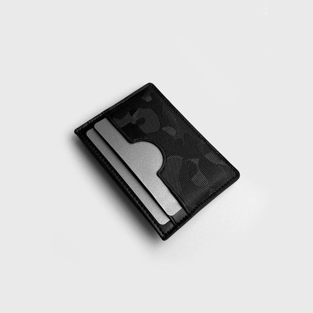 Black slim card holder with textured pattern and two card slots on light background