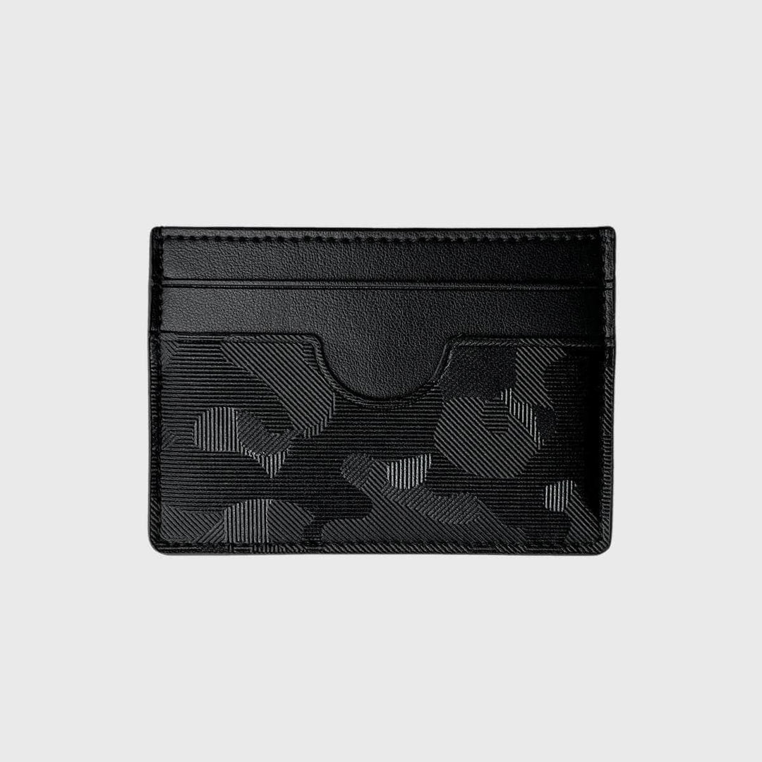 Black vegan leather slim card holder with geometric textured pattern on a light background