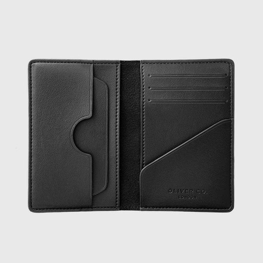 Black vegan leather compact wallet with multiple card slots and a sleek minimalist design
